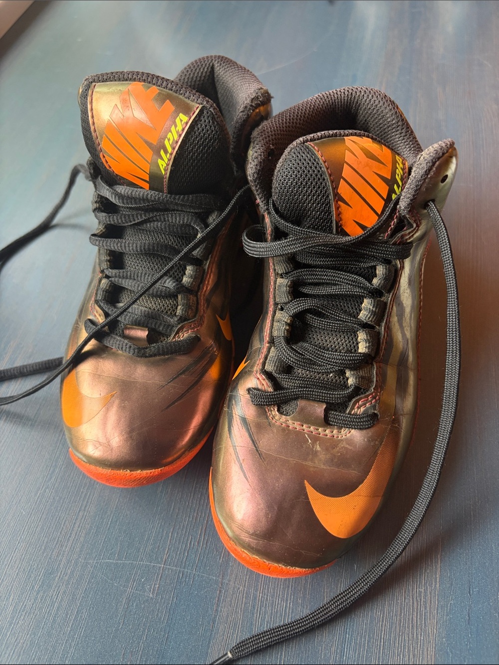 Nike Kids Black baseball cleats with Orange Accents
